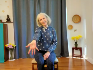 Patricia Becker demonstrating Chair yoga wrisit stretches