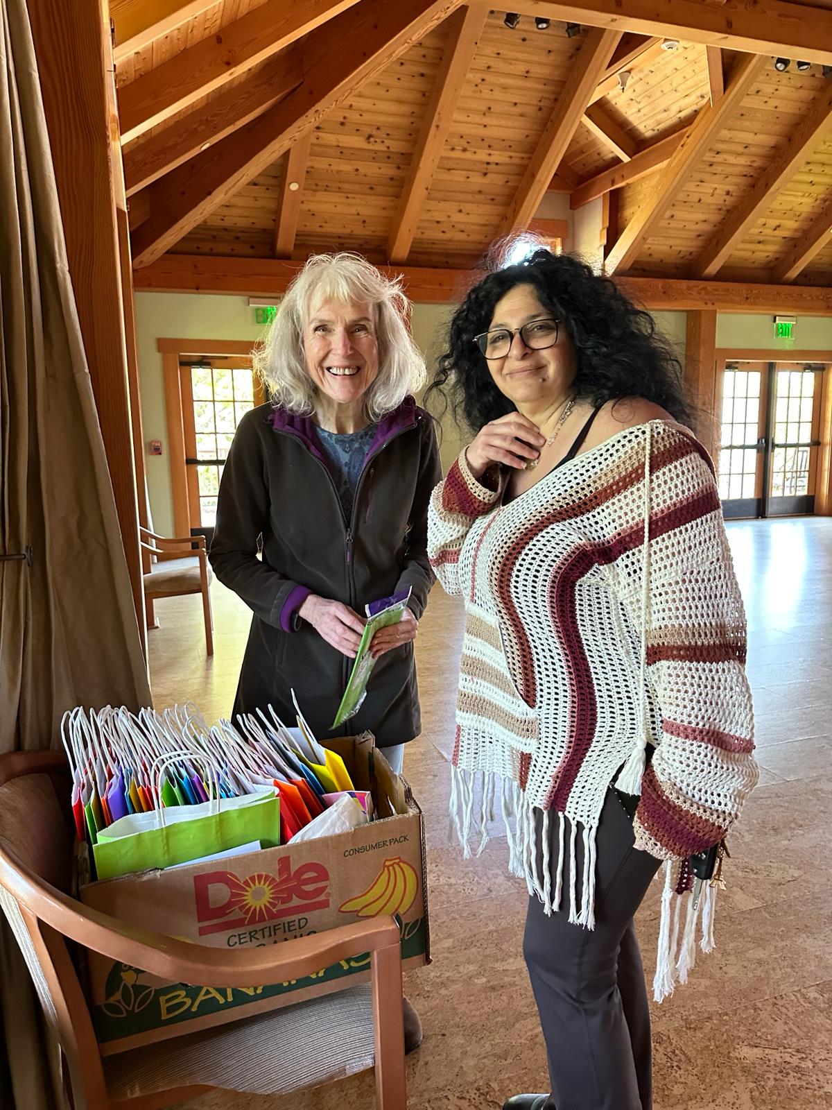 Patricia and Jouhania setting up yoga retreat room 